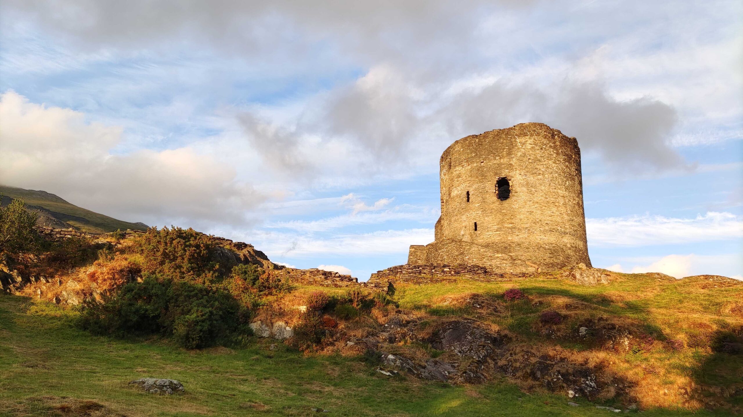 A part of an old castle in nature with sunshine on it